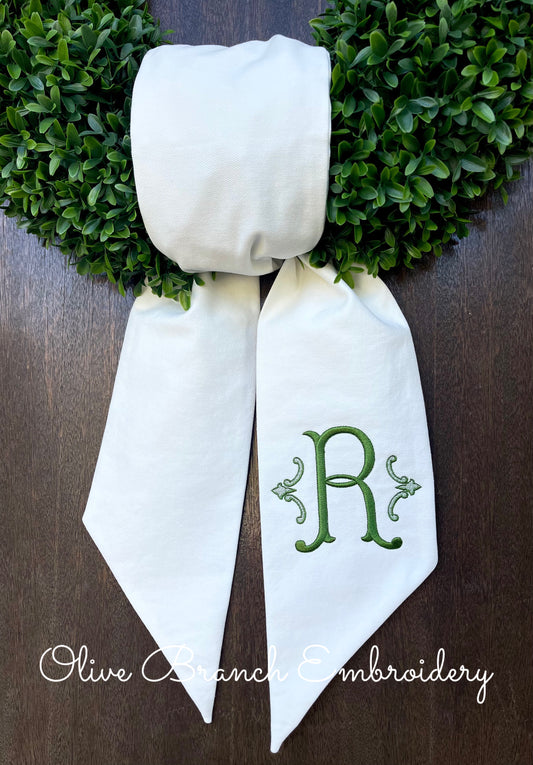 Wreath Sash with Romanesque Monogram